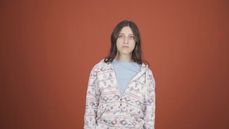 Young-woman-looking-depressed-at-camera.